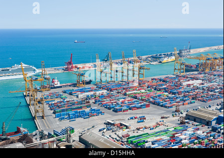 Barcelona, Spain - June 18, 2010: Detail of cargo loading docks and pleasure cruise ship in Barcelona harbour Stock Photo