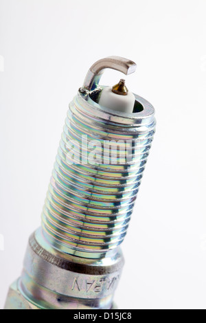 Close up of a spark plug isolated on white background Stock Photo