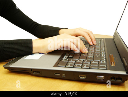 hands fast typing on laptop Stock Photo