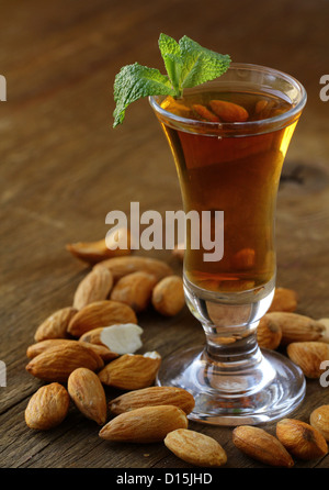 Almond liquor amaretto with whole nuts Stock Photo