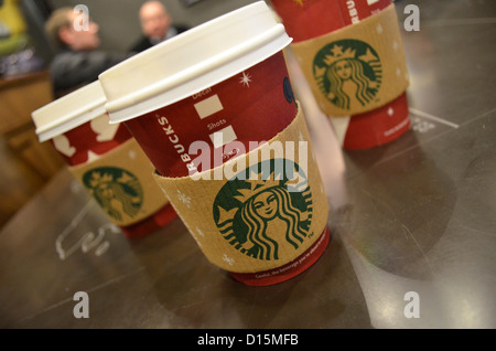 3 Starbucks Christmas take away cups Stock Photo