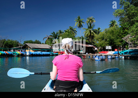 woman female sea kayaking Kayak Ao Thalane krabi thailand Phang Nga bay ao nang adventure activity Stock Photo