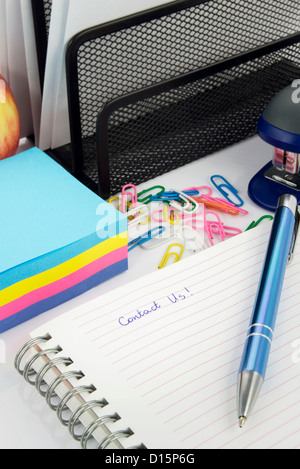 Contact Us caption on notepad Stock Photo