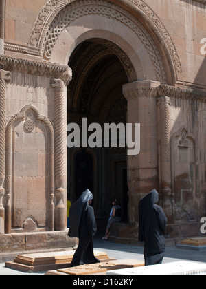 Priests in Echmiadzin Mayr Tachar cathedral Stock Photo