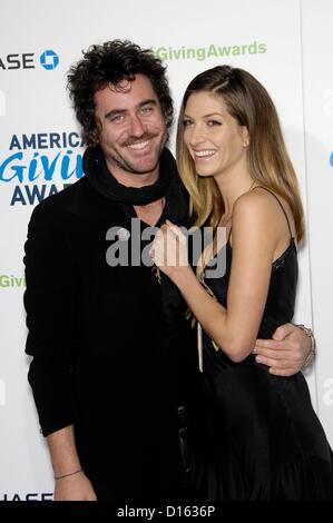 Bryn Mooser, Dawn Olivieri at arrivals for American Giving Awards 2012, Pasadena Civic Auditorium, Pasadena, CA December 7, 2012. Photo By: Michael Germana/Everett Collection Stock Photo