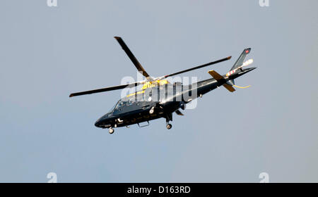 Dyfed Powys Police helicopter hovering above the scene of a car accident on the A4067 between Ystradgynlais and Ystalyfera in the Upper Swansea Valley today.One vehicle was involved in the crash which happened  at 08:10am. The road has been closed all day with police and fire service attending the scene. Stock Photo