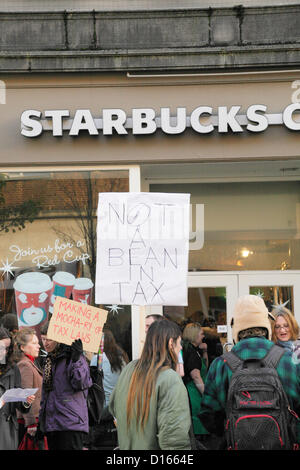 Exeter, UK, Saturday 8th December 2012. Protesters picket Starbucks Coffee Shop in Exeter High Street over the company's tax avoidance practices. Alamy Live News Stock Photo