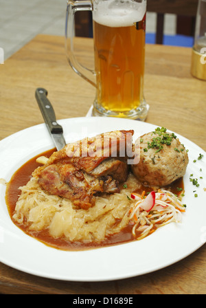 Braised Pork Knuckle dinner with beer, served at Airbräu Bavarian tavern in Munich, Germany Stock Photo