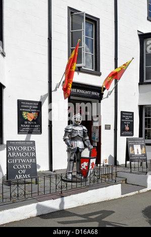 Unusual The Knight Shop in Conwy town sells swords armour coats of arms mannequin lifesize dummy in suit of armour holding shield Clwyd North Wales UK Stock Photo