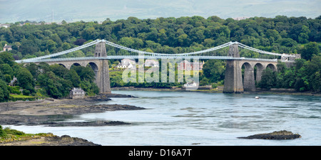 Menai Bridge designed by Thomas Telford crossing the Menai Straits waterway by road connecting island of Anglesey with the North Wales UK mainland Stock Photo