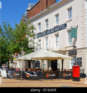 People relaxing outside the Saracens Head Hotel Chelmsford town centre High Street Essex England UK Stock Photo