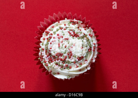 Christmas mince pie cupcake isolated on red background - looking down on from above Stock Photo