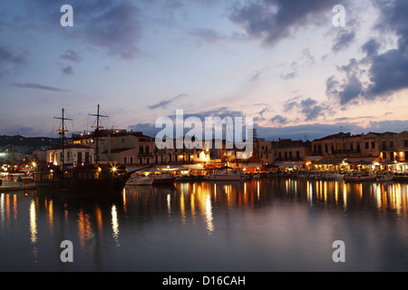 Dusk falls on the Mediterranean port of Rethymnon on Crete, Greece. Stock Photo