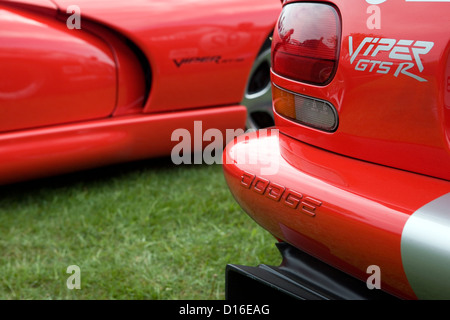 A Dodge Viper GTS R parked next to another Dodge Viper at a car show. Stock Photo