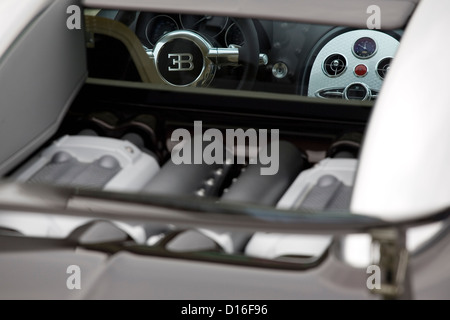 A view of the rear and interior of a Bugatti Veyron parked at a classic car show. Stock Photo