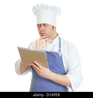 Handsome chef cook using tablet pc. Isolated on white Stock Photo