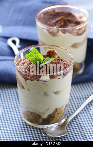Traditional Italian dessert tiramisu in a glass beaker Stock Photo