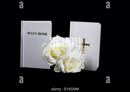 A bible and a Catholic Mass Book on Black Stock Photo