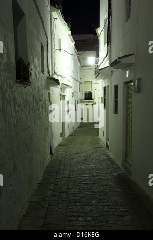 Narrow street in Andalusian village Casares at night, Spain Stock Photo