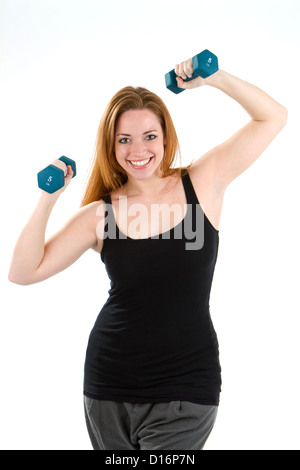Woman having fun exercising and working out using dumbbells. Stock Photo