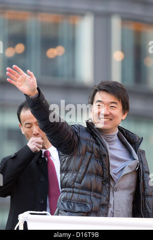 December 9, 2012, Tokyo, Japan - Osaka Mayor Toru Hashimoto, who has founded the Japan Restoration Party, waves to a crowd of voters during his stumping stop at the Tokyo railroad station on Sunday, December 9, 2012, in his campaign for the December 16 general election. A recent poll showed Hashimoto's JRP followed close behind the most favored Liberal Democratic Party led by former Prime Minister Shinzo Abe. (Photo by AFLO) Stock Photo