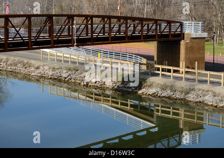 Steel foot bridge across the Erie Canal. Stock Photo