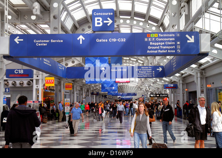 Illinois,IL Cook County,O'Hare International Airport,ORD,gate,terminal,passenger passengers rider riders,luggage,suitcase,sign,information,directions, Stock Photo