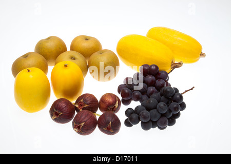 Various types of fruits against white background Stock Photo