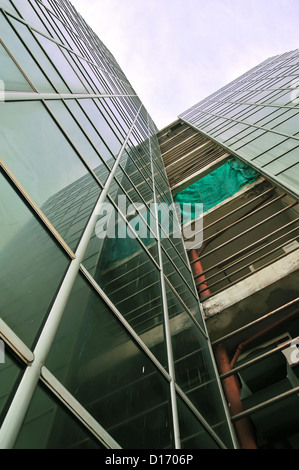 underside angle view to textured background of modern glass building skyscrapers Stock Photo