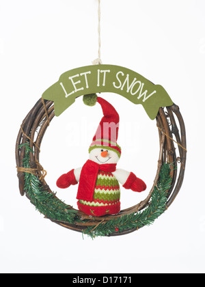 closeup of hanging christmas wreath with funny dressed snowman with the message 'let it snow', isolated on white Stock Photo