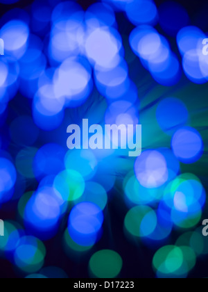 closeup of a fiber optic light wand with round shaped defocused blue and green light spots Stock Photo