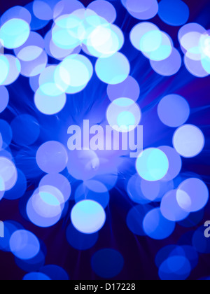 closeup of a fiber optic light wand with round shaped blue and white light spots Stock Photo