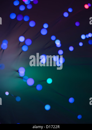abstract closeup of a fiber optic light wand with round shaped blue lights at the end of each fiber Stock Photo