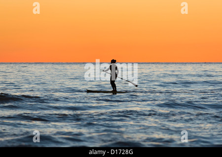 Woman doing stand up paddle surf. Tarifa, Costa de la Luz, Cadiz, Andalusia, Spain.