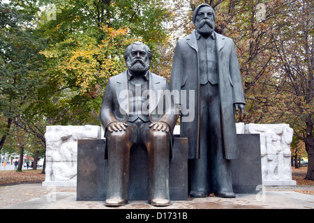 The statues of Karl Marx  (sitting) and Friedrich Engels (standing) Mitte  Berlin Germany Stock Photo