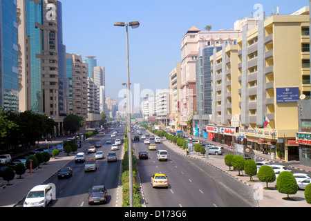 Dubai UAE,United Arab Emirates,Deira,Al Rigga,Al Maktoum Road,street scene,businesses,district,traffic,buildings,city skyline,English,Arabic,language, Stock Photo