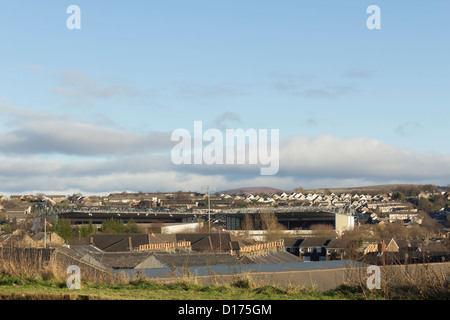 The top of the stands of Burnley FC stadium Turf Moor and the suburban areas of Burnley viewed from the Leeds-Liverpool canal Stock Photo