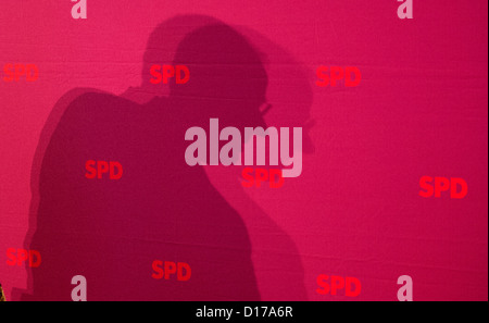 Designated SPD candidate for the chancellorship, Peer Steinbrueck, throws a shadow as he attends the meeting of the party's federal board in Hanover, Germany, 08 December 2012. The extraordinary SPD party conference will take place in Hanover on 09 December 2012. Photo: JULIAN STRATENSCHULTE Stock Photo