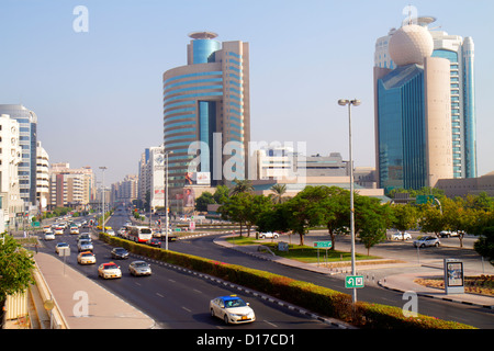 Dubai UAE,United Arab Emirates,Deira,Al Maktoum Road,traffic,taxi,taxis,cab,cabs,Dubai Creek Tower,Al Reem Tower,Etisalat Tower I,UAE121012036 Stock Photo