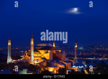 Night lights on Hagia Sophia under a full moon at twilight in Istanbul Turkey Stock Photo