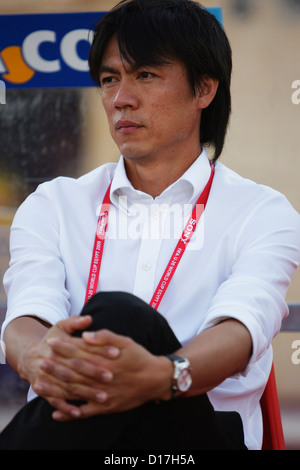 SUEZ, EGYPT - SEPTEMBER 29:  South Korea Head Coach Myung Bo Hong sits on the team bench before kick off of the 2009 FIFA U-20 World Cup Group C match against Germany at Mubarak Stadium on September 29, 2009 in Suez, Egypt. Editorial use only. Commercial use prohibited. (Photograph by Jonathan Paul Larsen / Diadem Images) Stock Photo