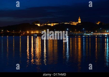 Topkapi Palace at early morning twilight with lights reflected in the Golden Horn Istanbul Turkey Stock Photo