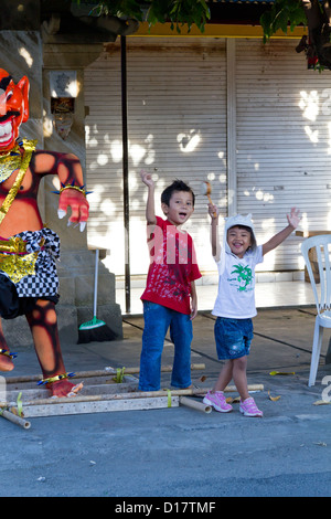 Happy Children playing on the Street in Jimbaran, Bali Stock Photo