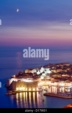 Dusk view of the old harbour port and old town in the city of Dubrovnik on the Adriatic coast of Croatia. Stock Photo