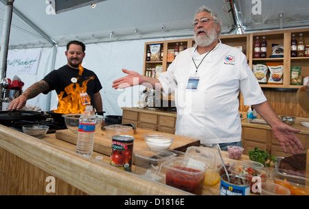 Cookbook author and chef during cooking demonstration at kitchen set up during the Texas Book Festival in Austin Stock Photo