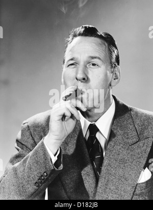 Man smoking cigar Stock Photo