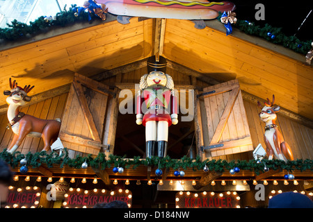 The traditional German-style wooden huts of the Southbank Centre Christmas market along the river Stock Photo