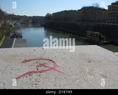 hammer and sickle symbol painted on bridge in roma italy Stock Photo