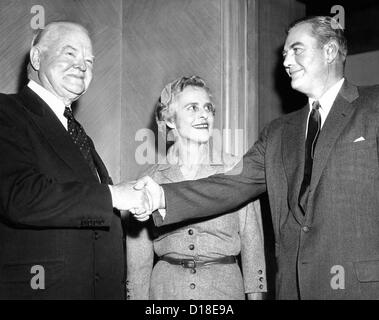 Former president Herbert Hoover with his son, Herbert Jr. and his wife. The previous year Hoover Jr. won praise when he Stock Photo