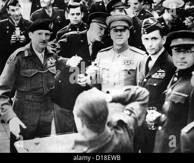 Allied leaders drink a victory toast at Frankfurt am Main, Germany. L-R: Field Marshall Sir Bernard Montgomery; Gen. Dwight Stock Photo